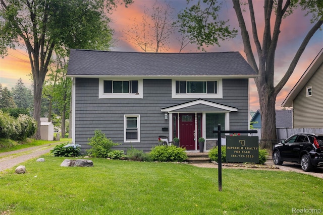 50848 Ashley St, New Baltimore, MI 48047 - view of front of home with a lawn and roof with shingles