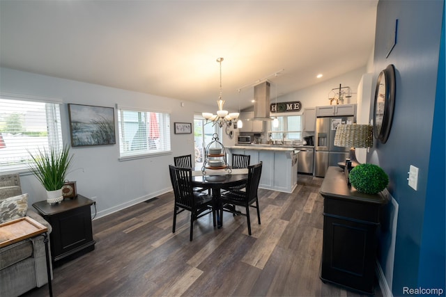 50848 Ashley St, New Baltimore, MI 48047 - dining room with a chandelier, dark wood finished floors, vaulted ceiling, and baseboards