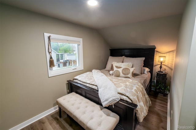 50848 Ashley St, New Baltimore, MI 48047 - bedroom featuring dark wood-style flooring, vaulted ceiling, and baseboards