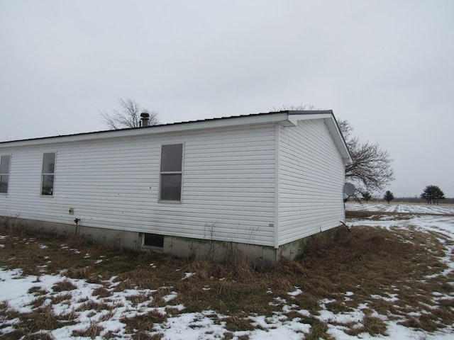 view of snow covered property