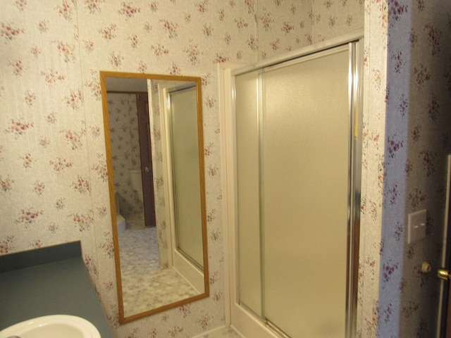 bathroom with a shower with shower door