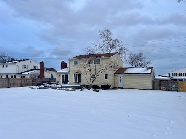 view of snow covered house