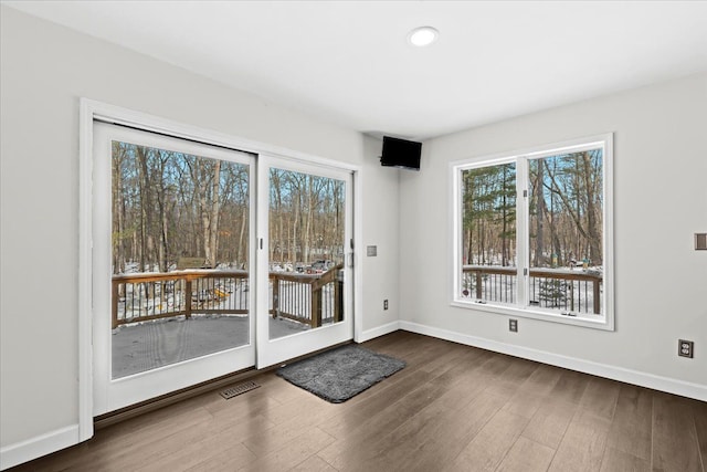 doorway featuring dark hardwood / wood-style floors