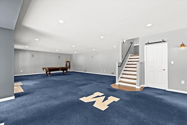 playroom with dark colored carpet, a barn door, and billiards