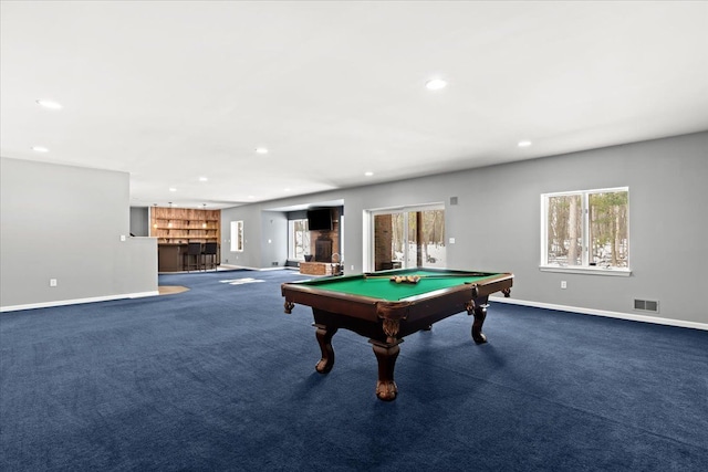 rec room featuring billiards, dark colored carpet, and bar area