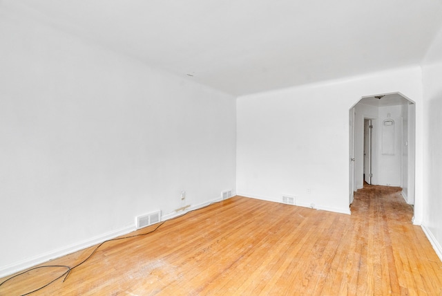 spare room with light hardwood / wood-style flooring