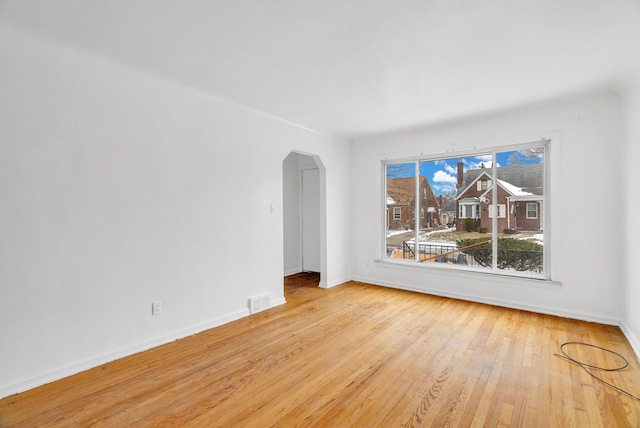 spare room featuring light hardwood / wood-style floors