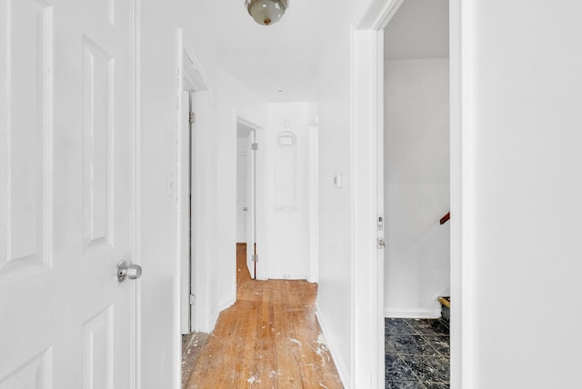 hall with light hardwood / wood-style floors