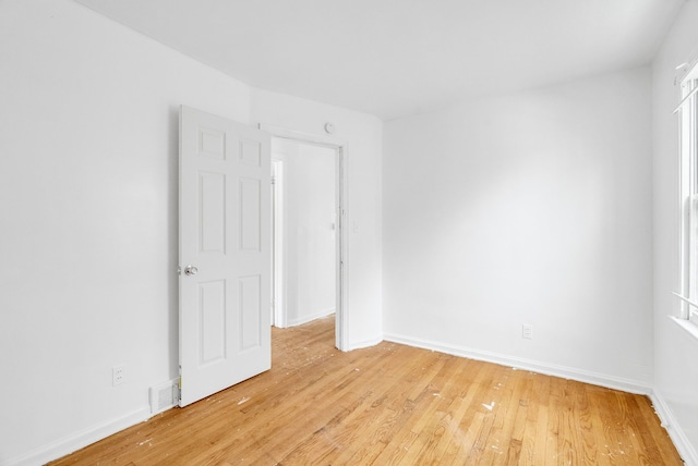 spare room featuring light wood-type flooring