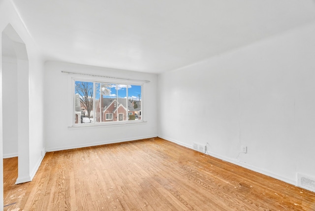 spare room featuring light wood-type flooring