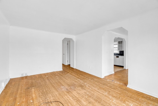 spare room featuring light hardwood / wood-style floors