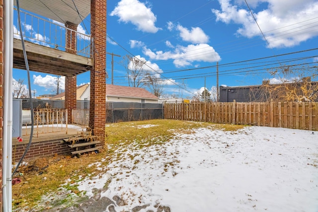 view of yard layered in snow