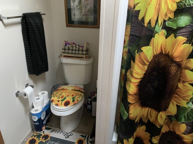 bathroom featuring toilet and tile patterned floors