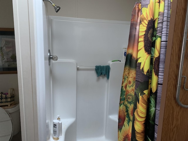 bathroom with a shower with shower curtain