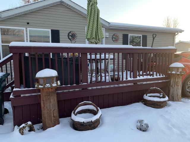 view of snow covered deck