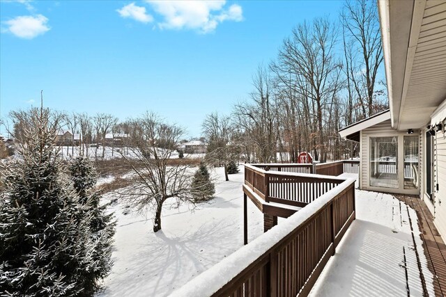 view of snow covered deck