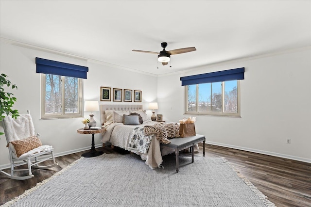 bedroom featuring ceiling fan, dark wood-type flooring, and crown molding