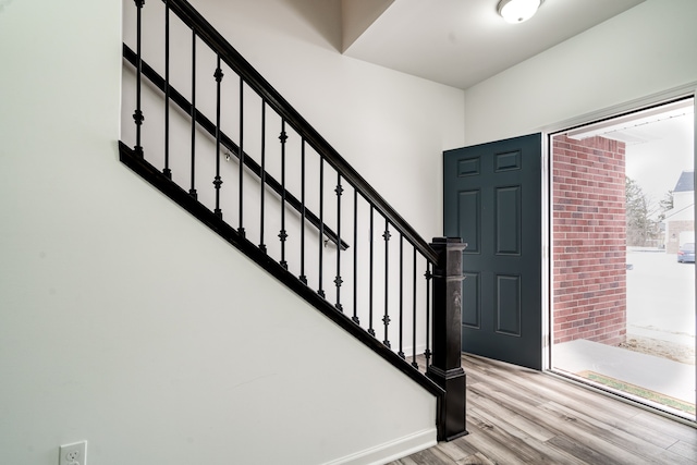 foyer entrance with light wood-type flooring