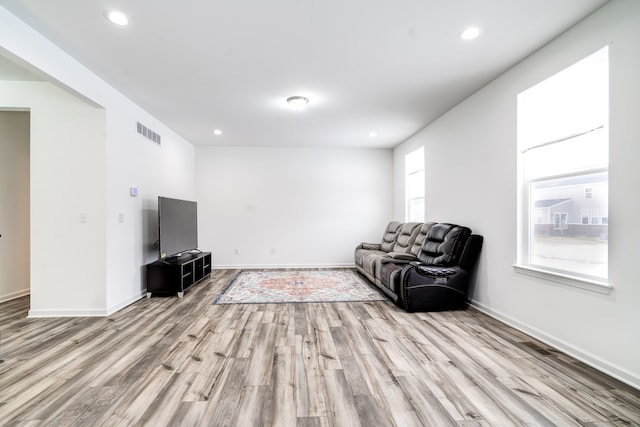 sitting room featuring light hardwood / wood-style flooring