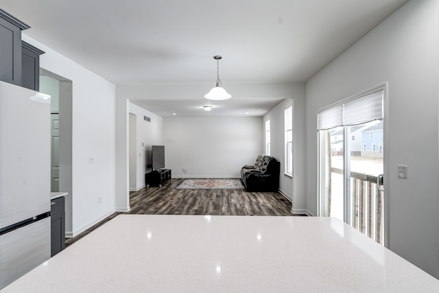 unfurnished living room featuring dark wood-type flooring