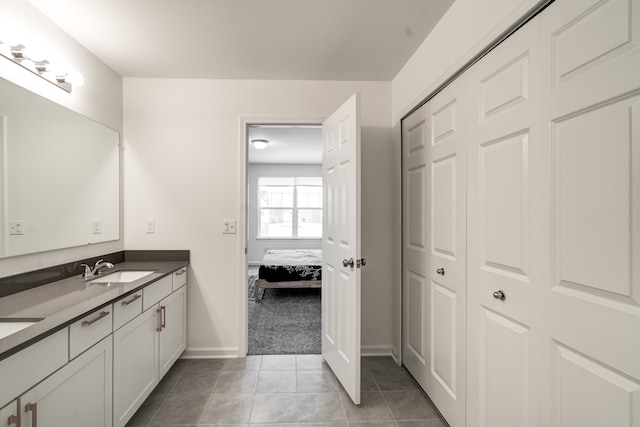 bathroom with vanity and tile patterned flooring