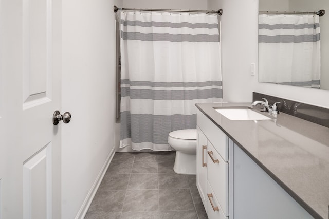 bathroom featuring toilet, vanity, tile patterned floors, and walk in shower