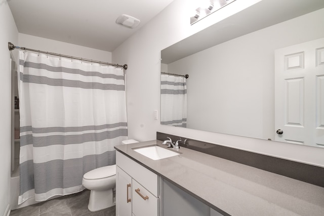 full bathroom featuring shower / bath combo with shower curtain, tile patterned floors, toilet, and vanity