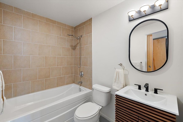 full bathroom featuring toilet, vanity, and tiled shower / bath combo