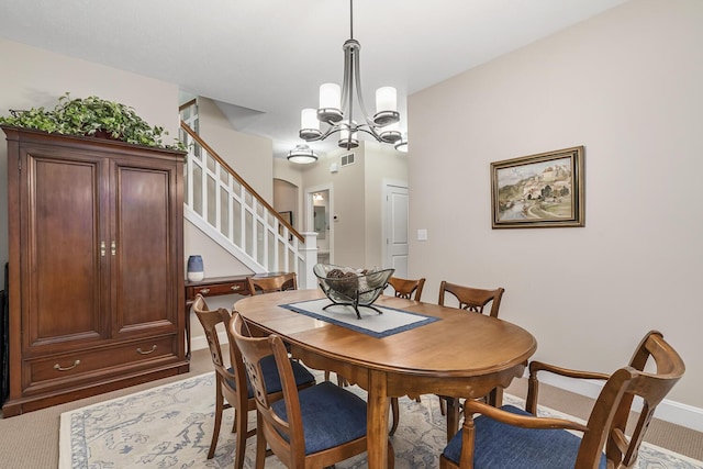 dining space with a notable chandelier