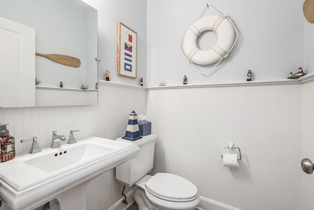 bathroom featuring sink and toilet