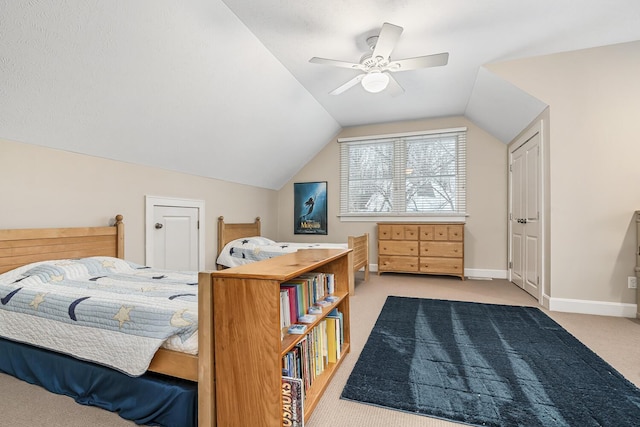 bedroom with ceiling fan, light colored carpet, and lofted ceiling