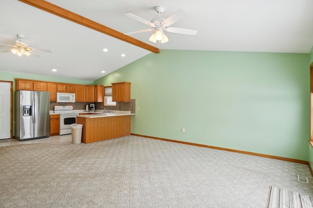 kitchen with ceiling fan, white appliances, kitchen peninsula, and vaulted ceiling with beams