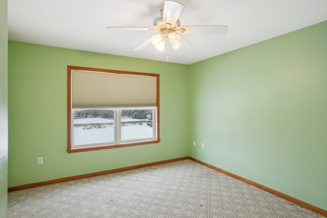 carpeted empty room with ceiling fan