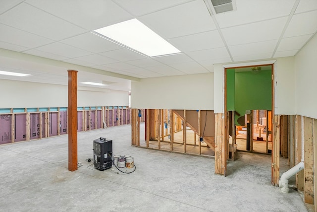 basement featuring a drop ceiling