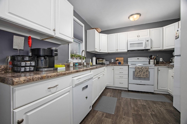 kitchen featuring dark wood-type flooring, white cabinetry, and white appliances