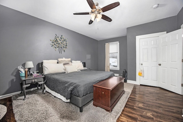 bedroom featuring ceiling fan and dark wood-type flooring