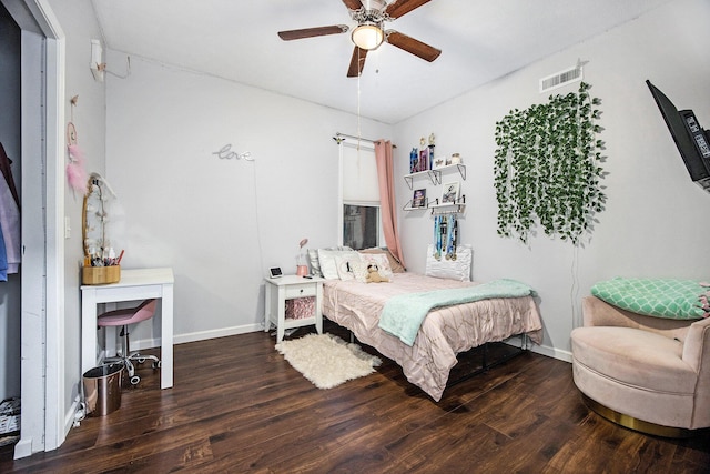 bedroom with ceiling fan and dark hardwood / wood-style floors