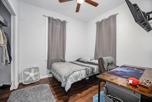 bedroom featuring dark wood-type flooring and ceiling fan