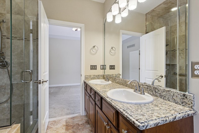 bathroom with walk in shower and vanity