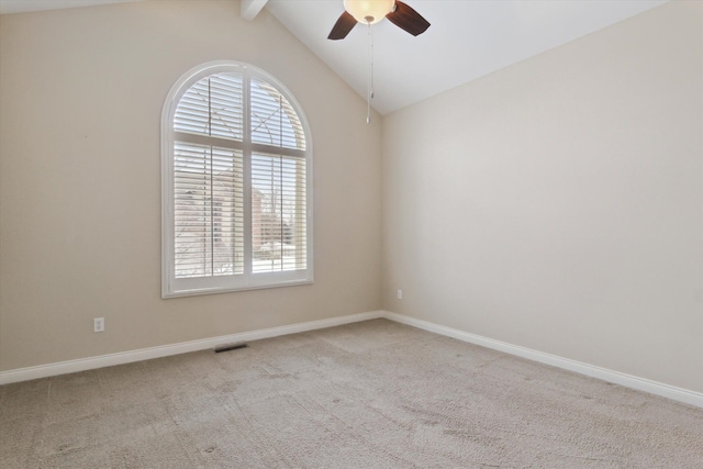 spare room featuring ceiling fan, light colored carpet, and lofted ceiling with beams