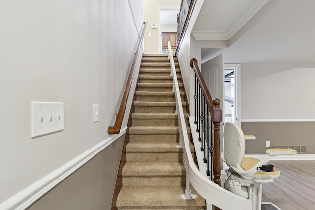 stairs featuring ornamental molding