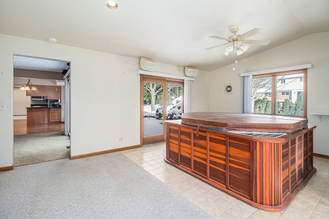 bar with an AC wall unit, lofted ceiling, ceiling fan, and light colored carpet