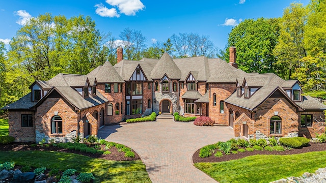 tudor home featuring a front yard