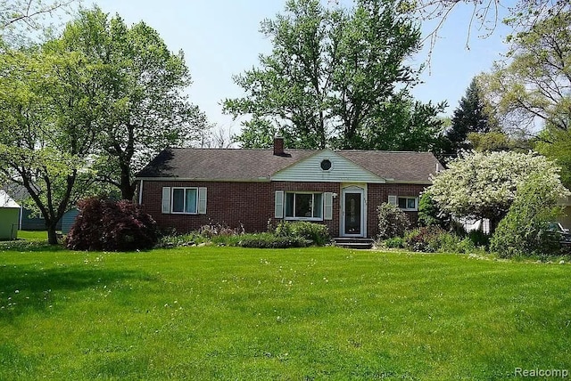 ranch-style home with a front lawn