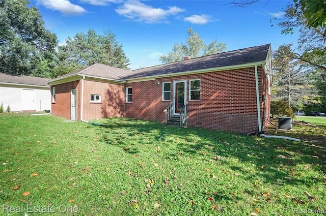 back of house with a yard