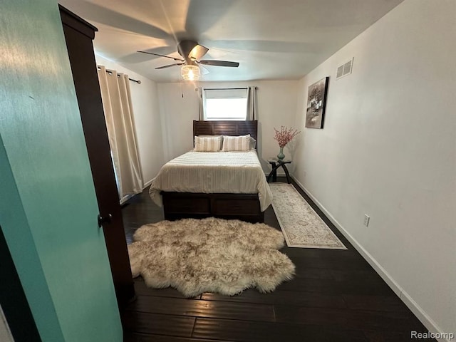 bedroom with dark wood-type flooring and ceiling fan