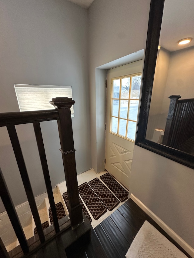 entryway with hardwood / wood-style flooring