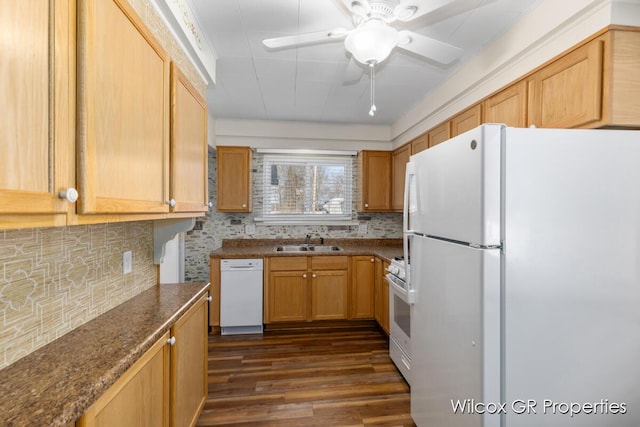 kitchen with ceiling fan, sink, white appliances, dark hardwood / wood-style floors, and decorative backsplash