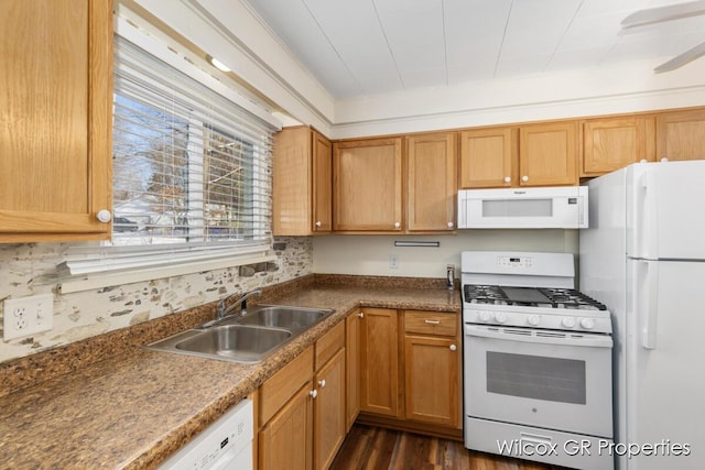 kitchen with white appliances, tasteful backsplash, sink, dark hardwood / wood-style floors, and crown molding