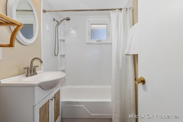 bathroom with shower / tub combo with curtain and vanity